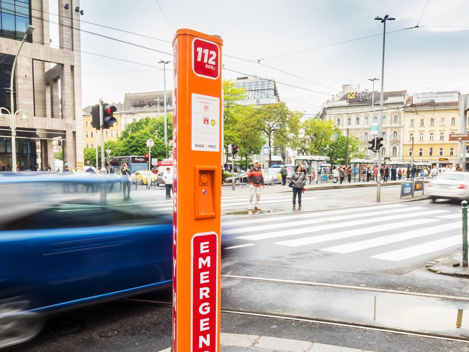 2N IP Safety intercom in a tall, standalone pillar on a busy street, designed for visibility and quick emergency access.