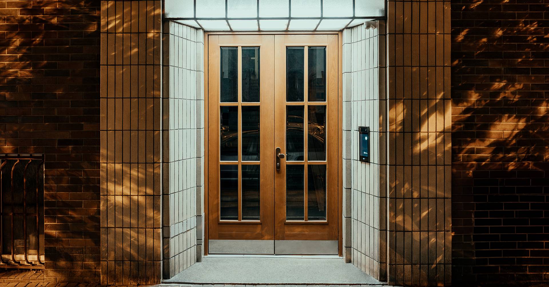 Building entrance secured by 2N door access control system