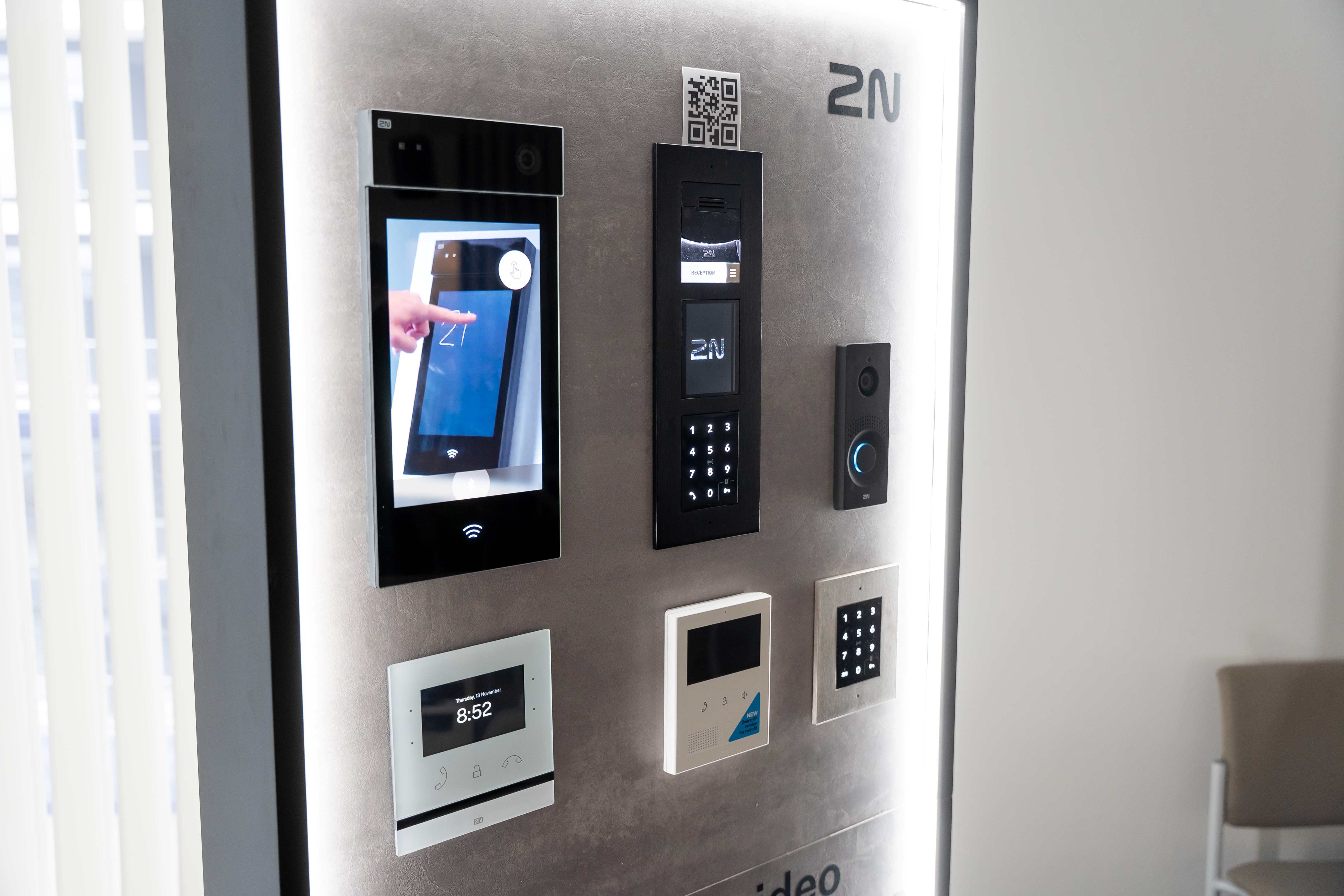 Display panel showcasing several 2N access control and intercom devices, including a video unit.