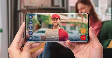 Smartphone displaying the My2N application with an active video call showing a delivery person at the door.
