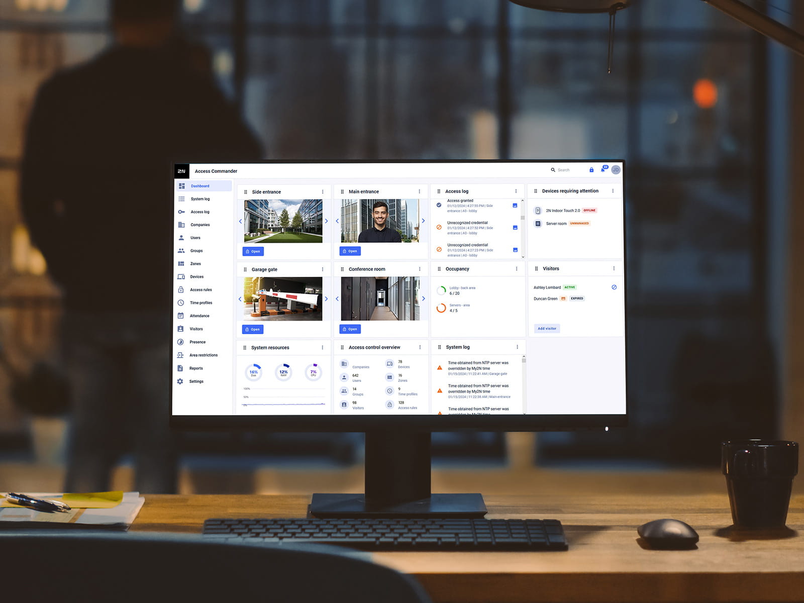Desktop monitor displaying a video management dashboard in an office setting.
